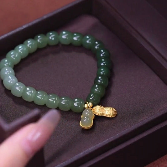Gradient Color Hetian Jade Bracelet with 18K Gold Peanut Pendant
